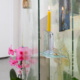 The Museum Archive (dedicated to Edward Steichen's Delphiniums, MOMA 1936), Version 5, 2026 5 panels of glass, resin, plants, beam splitter glass, photo gels, photographic prints and film, aluminum stand 56 x 36 x 22 in